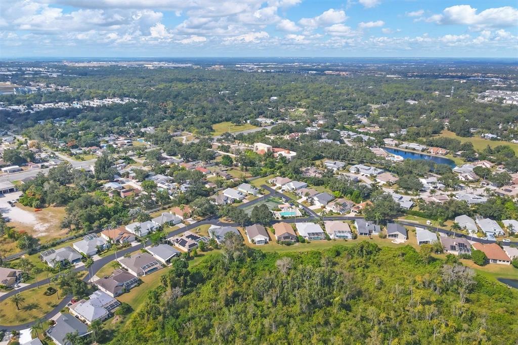 3350 Yonge Avenue, Unit 31 Sarasota, FL 34235 - Photo 34 of 39 an aerial view of residential houses with city view