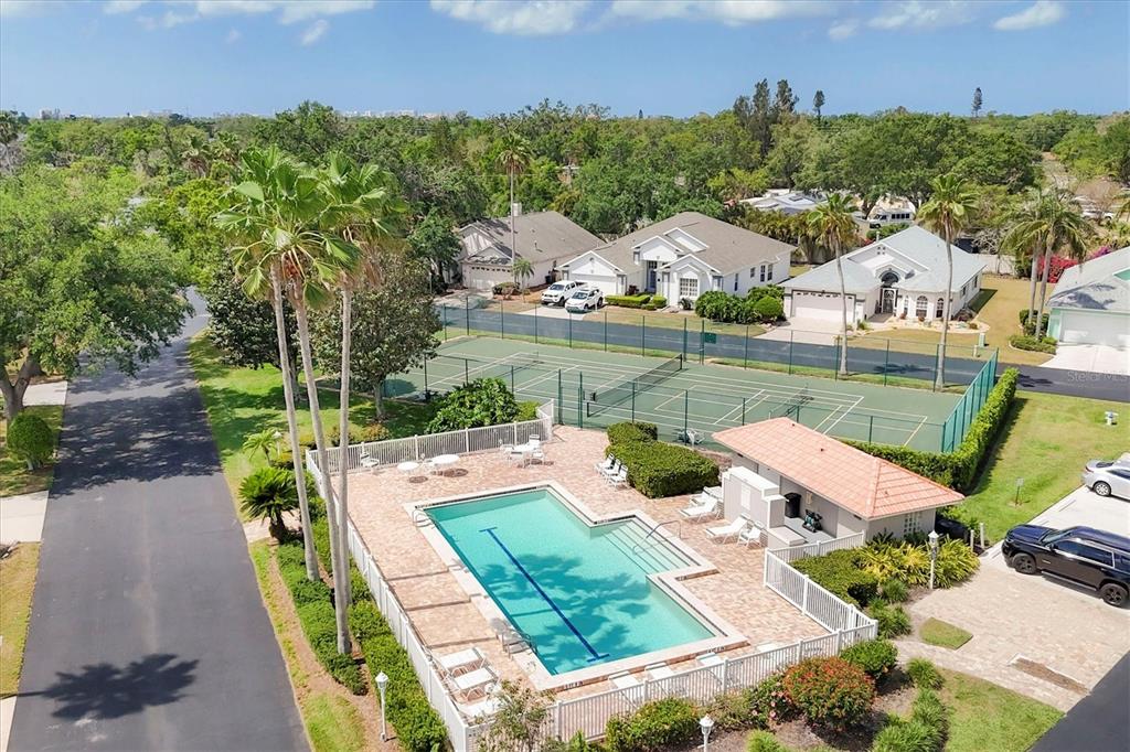 3350 Yonge Avenue, Unit 31 Sarasota, FL 34235 - Photo 37 of 39 an aerial view of a house with outdoor space and a lake view in back