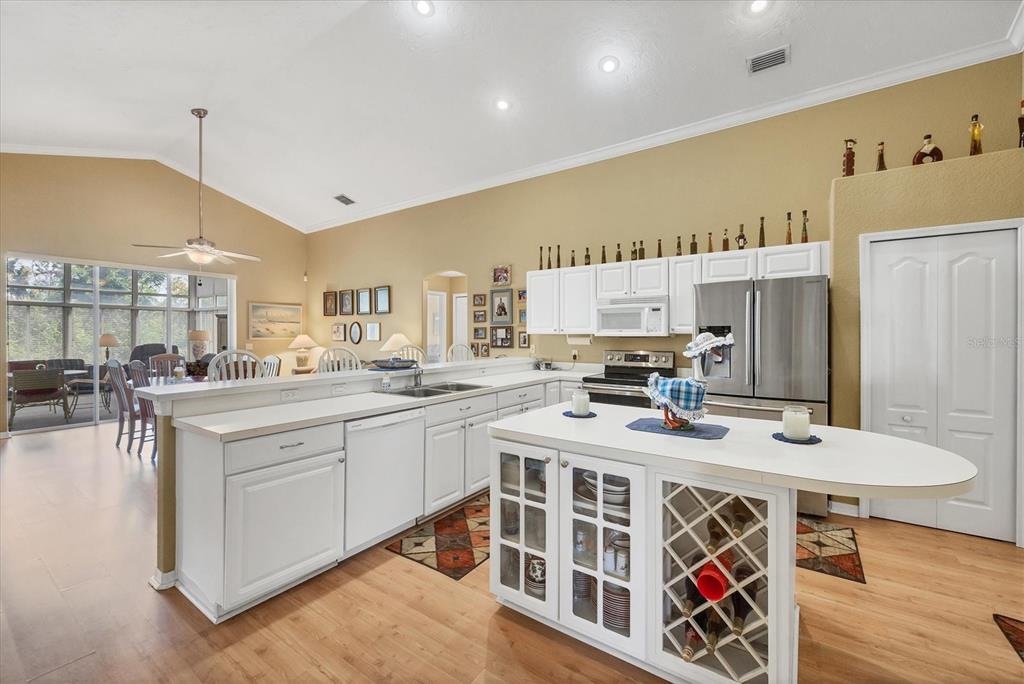 3350 Yonge Avenue, Unit 31 Sarasota, FL 34235 - Photo 7 of 39 a kitchen with stainless steel appliances granite countertop a sink and cabinets