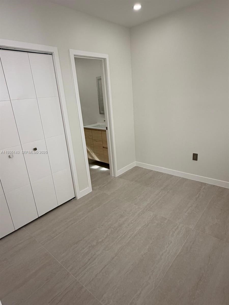 2436 Southwest 7th Street, Unit 11 Miami, FL 33135 - Photo 3 of 8 wooden floor and cabinet in a room