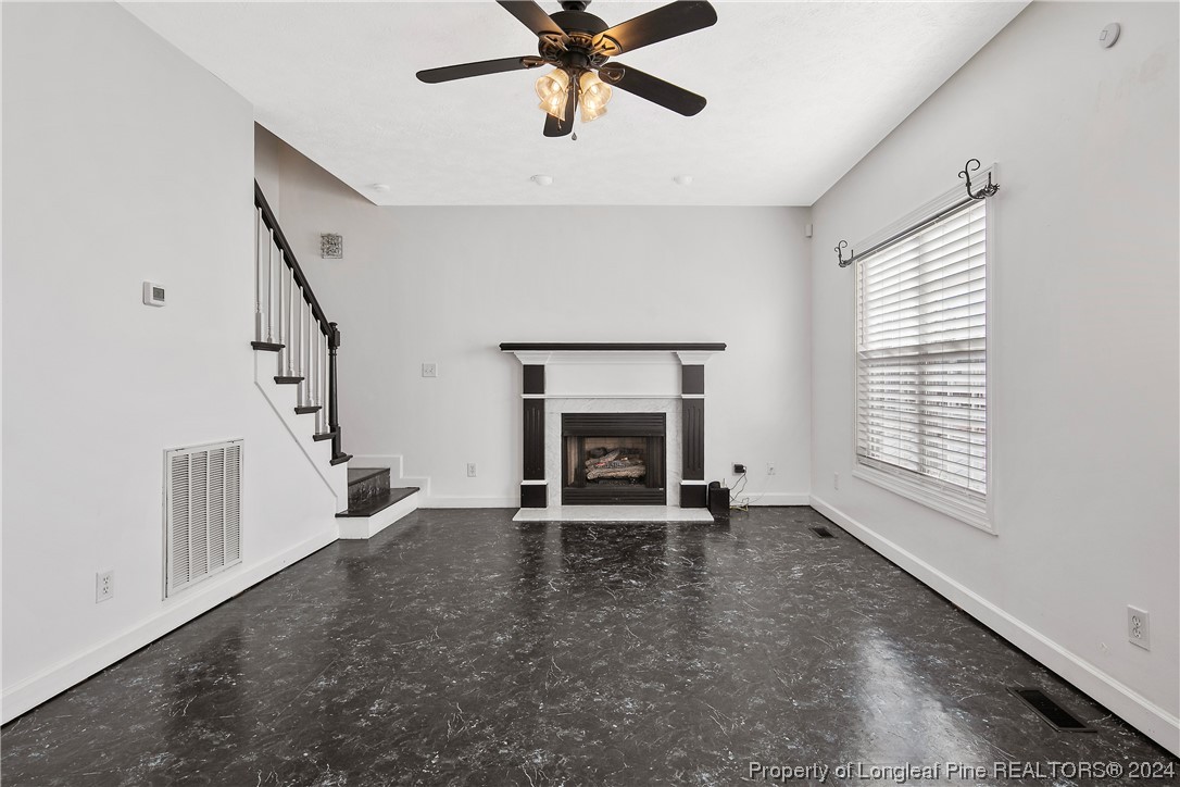 3525 Talus Road Fayetteville, NC 28306 - Photo 17 of 50 a view of an empty room with a fireplace and a window