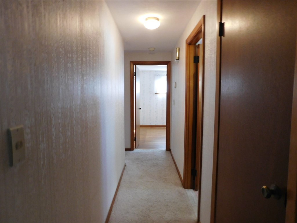 2 Deborah Road Warwick, RI 02888 - Photo 33 of 44 Hallway carpet covers hardwood flooring.