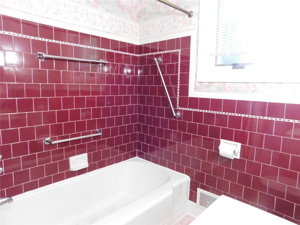 2 Deborah Road Warwick, RI 02888 - Photo 42 of 44 Tile surrounding tub area in excellent condition.