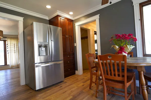 a kitchen with dining room and wooden floor