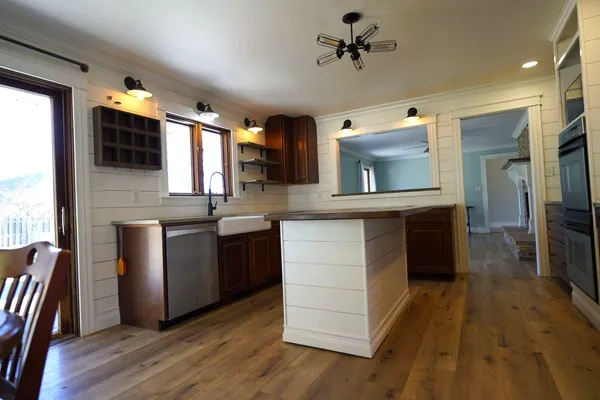 a kitchen with a refrigerator and a sink