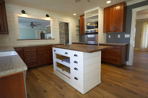 a kitchen with stainless steel appliances granite countertop a stove and a sink