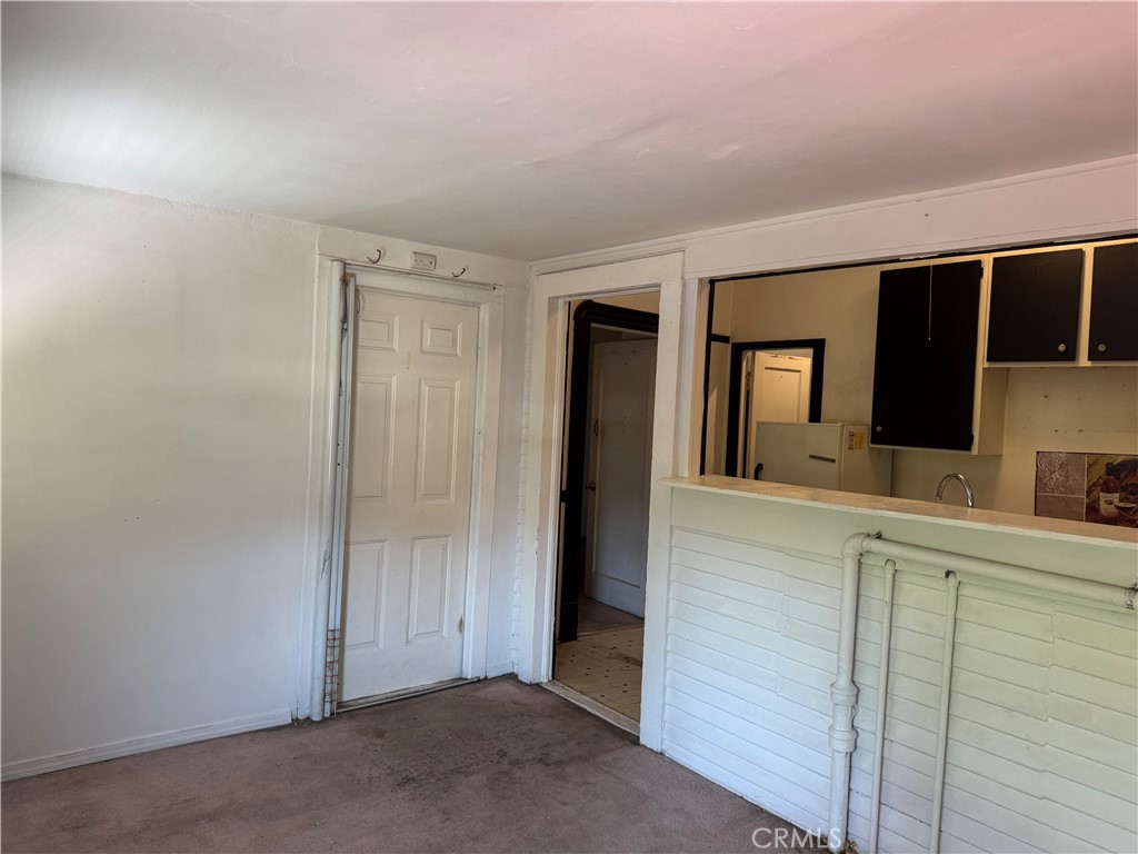 3499 Lemon Street Riverside, CA 92501 - Photo 23 of 32 a view of a hallway with closet and mirror