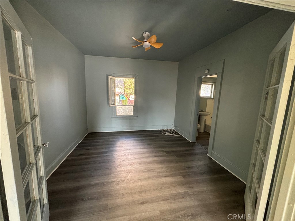 3499 Lemon Street Riverside, CA 92501 - Photo 7 of 32 an empty room with wooden floor and windows