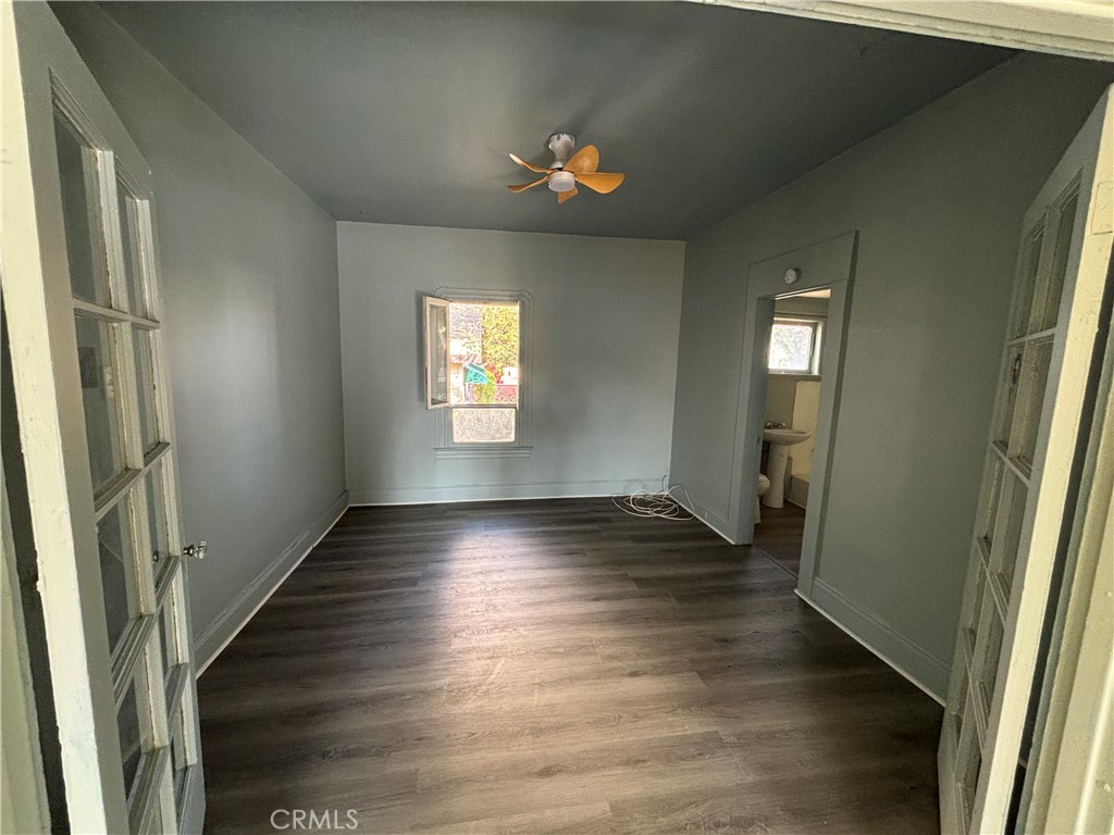 3499 Lemon Street Riverside, CA 92501 - Photo 8 of 32 a view of an empty room with wooden floor and a window