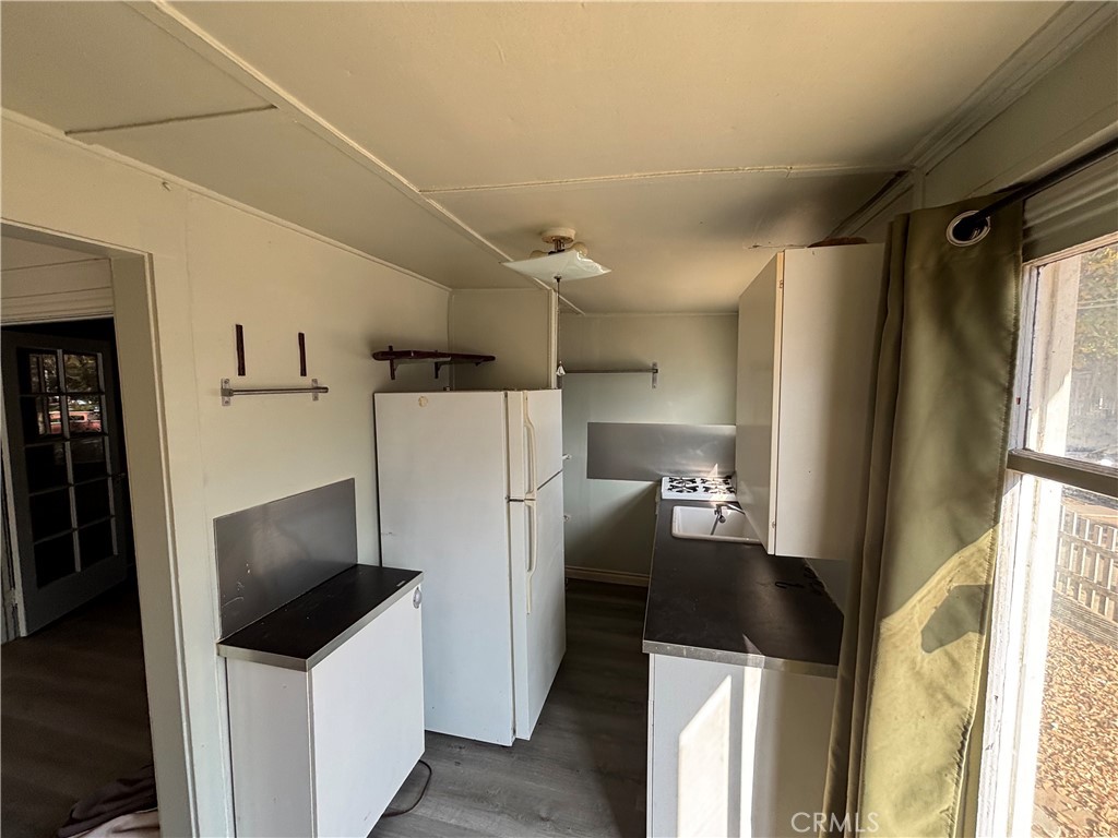 3499 Lemon Street Riverside, CA 92501 - Photo 10 of 32 a kitchen with stainless steel appliances a refrigerator and a stove