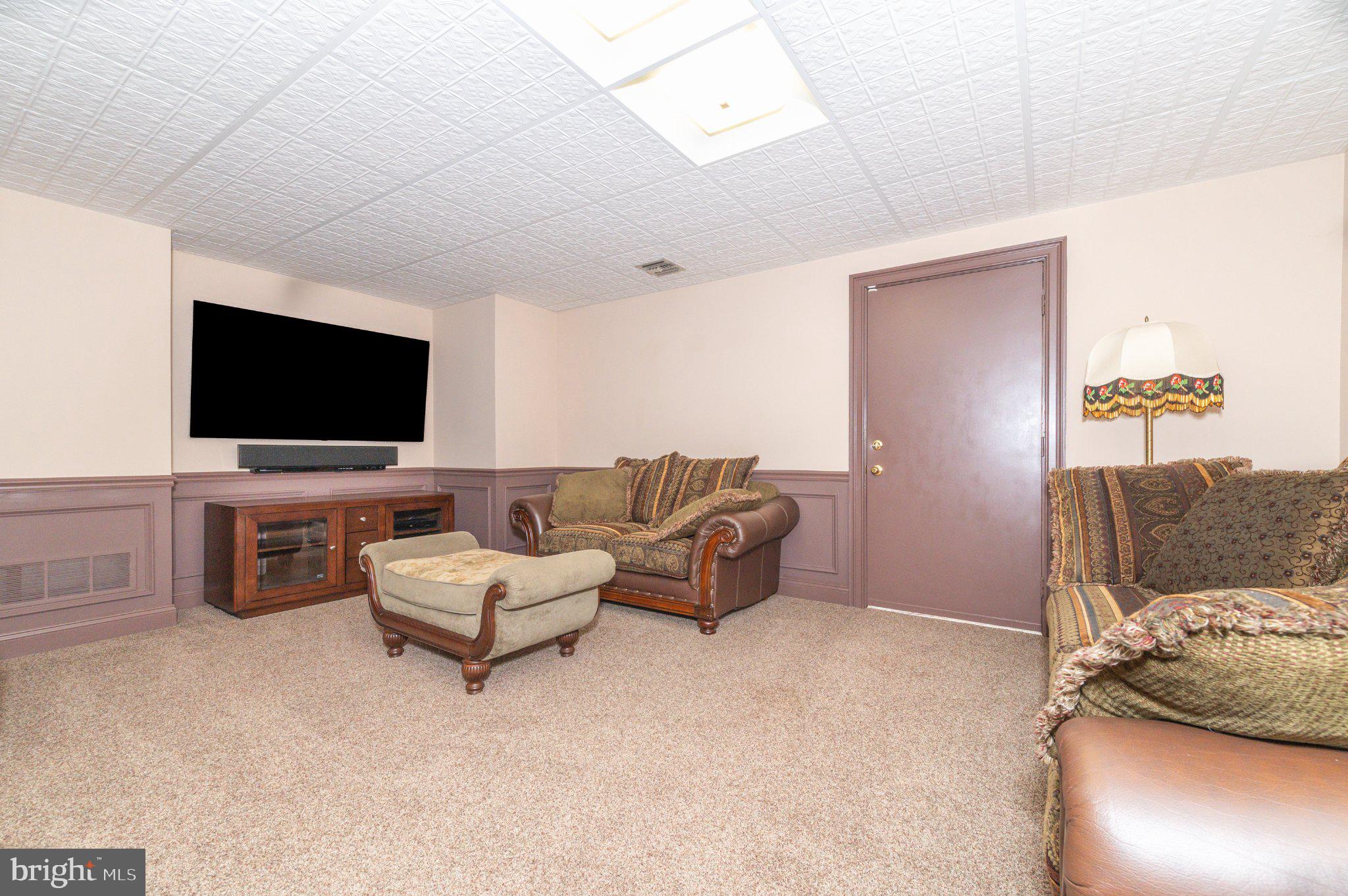 434 4th Street Atco, NJ 08004 - Photo 54 of 69 a living room with furniture and a flat screen tv
