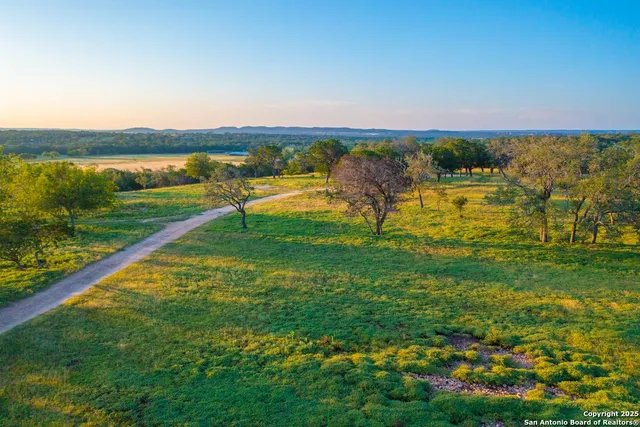 a view of a lake with houses in the back