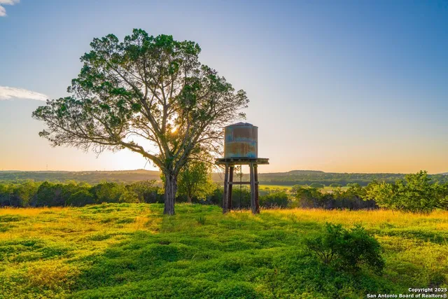 a view of a lake with a yard