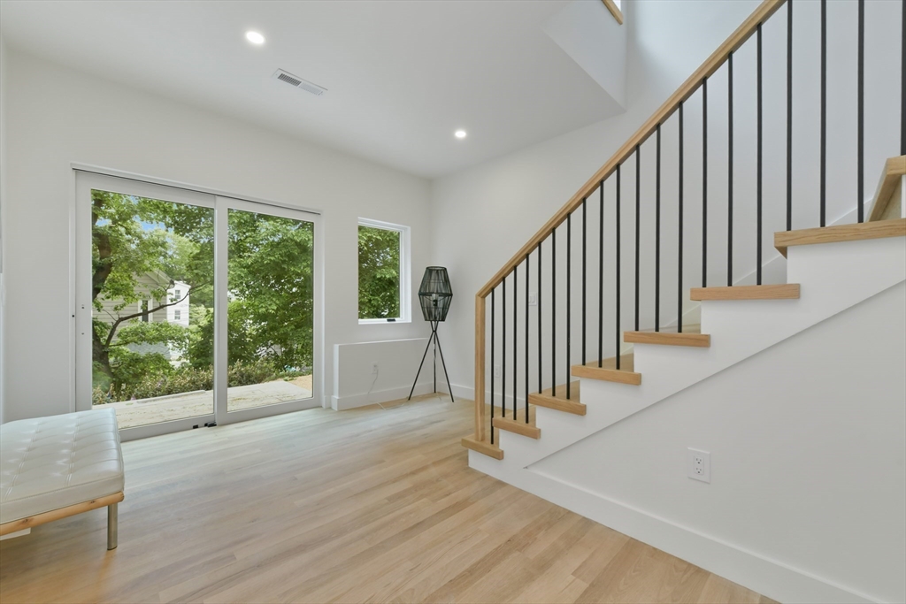 23 Eastman Road Somerville, MA 02143 - Photo 11 of 18 a view of a hallway with wooden floor and entryway