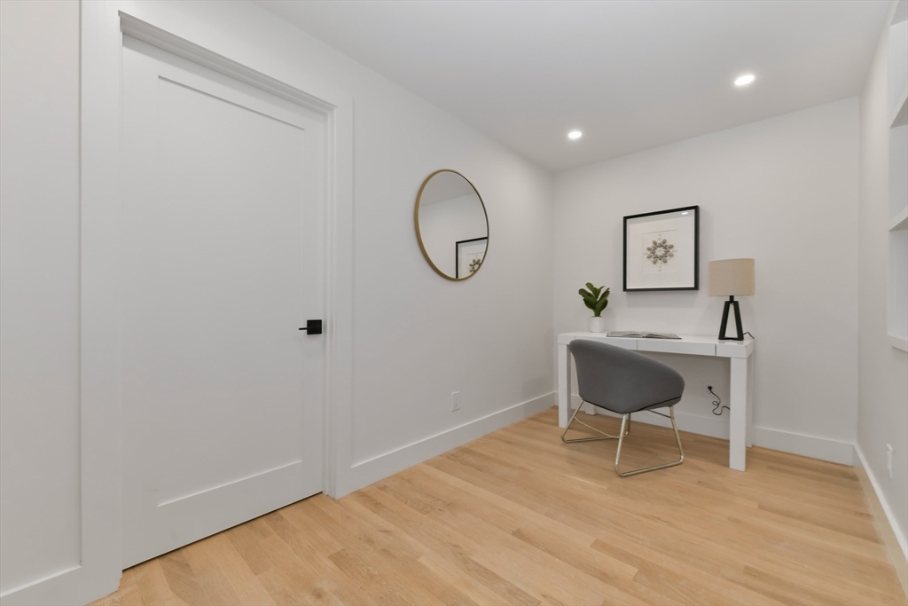 23 Eastman Road Somerville, MA 02143 - Photo 13 of 18 a view of a room with wooden floor lounge chair and windows