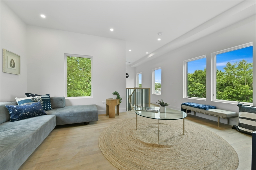 23 Eastman Road Somerville, MA 02143 - Photo 14 of 18 a living room with furniture and a large window