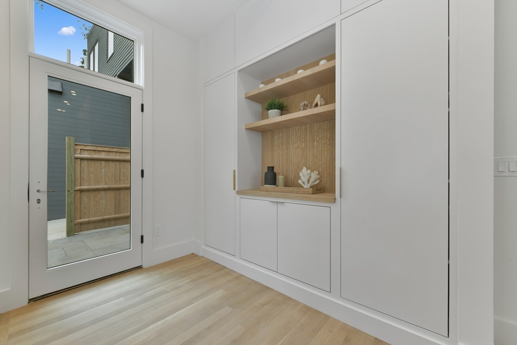 23 Eastman Road Somerville, MA 02143 - Photo 5 of 18 a view of an empty room with wooden floor and a window