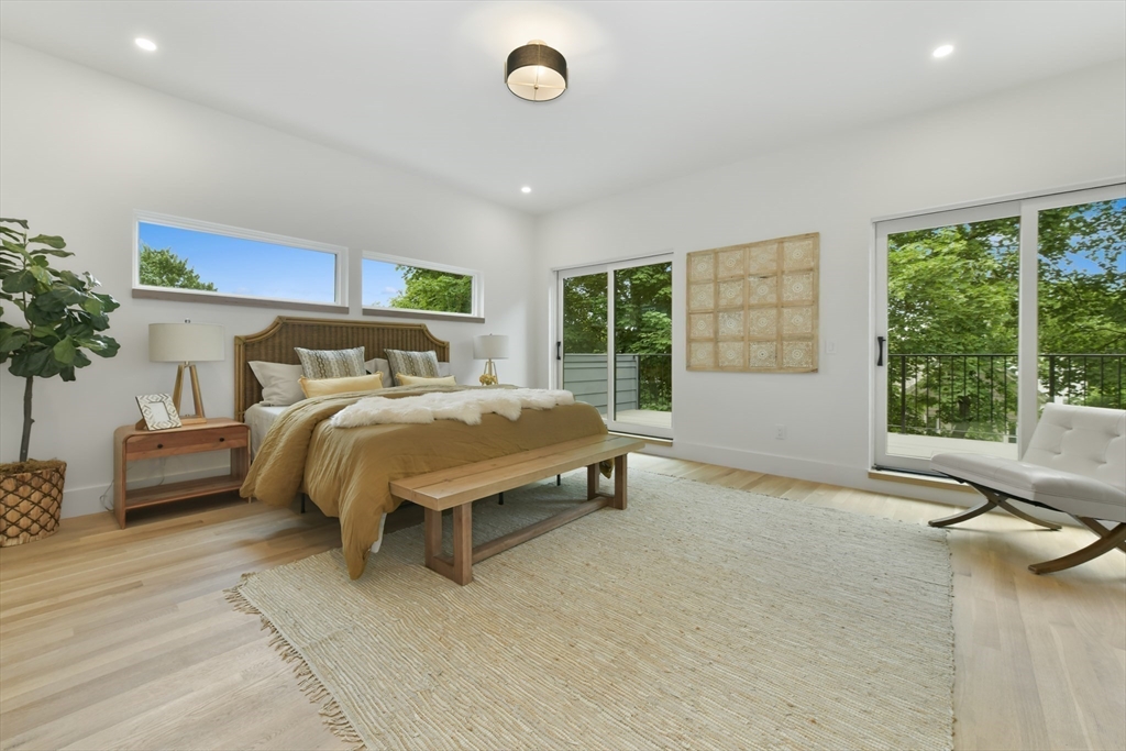 23 Eastman Road Somerville, MA 02143 - Photo 6 of 18 a bedroom with a bed and a window