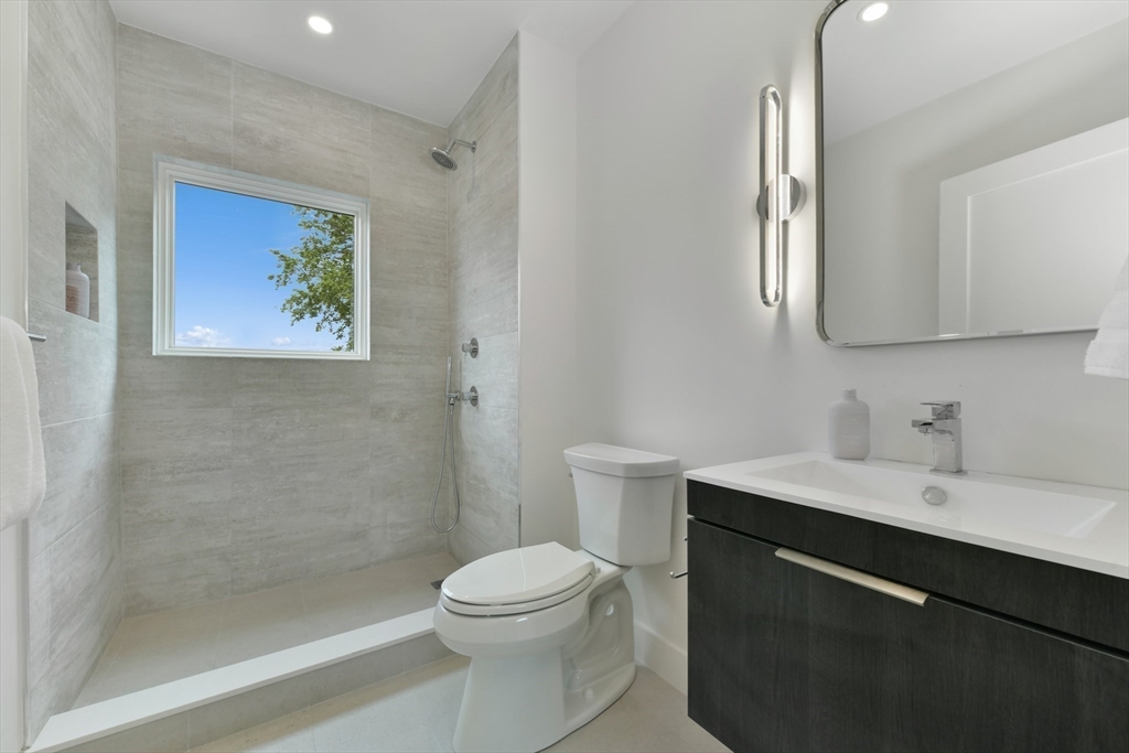 23 Eastman Road Somerville, MA 02143 - Photo 9 of 18 a bathroom with a toilet sink and mirror