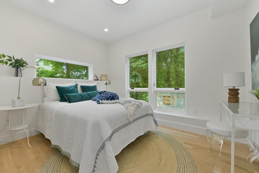 23 Eastman Road Somerville, MA 02143 - Photo 10 of 18 a bedroom with a bed and a large window