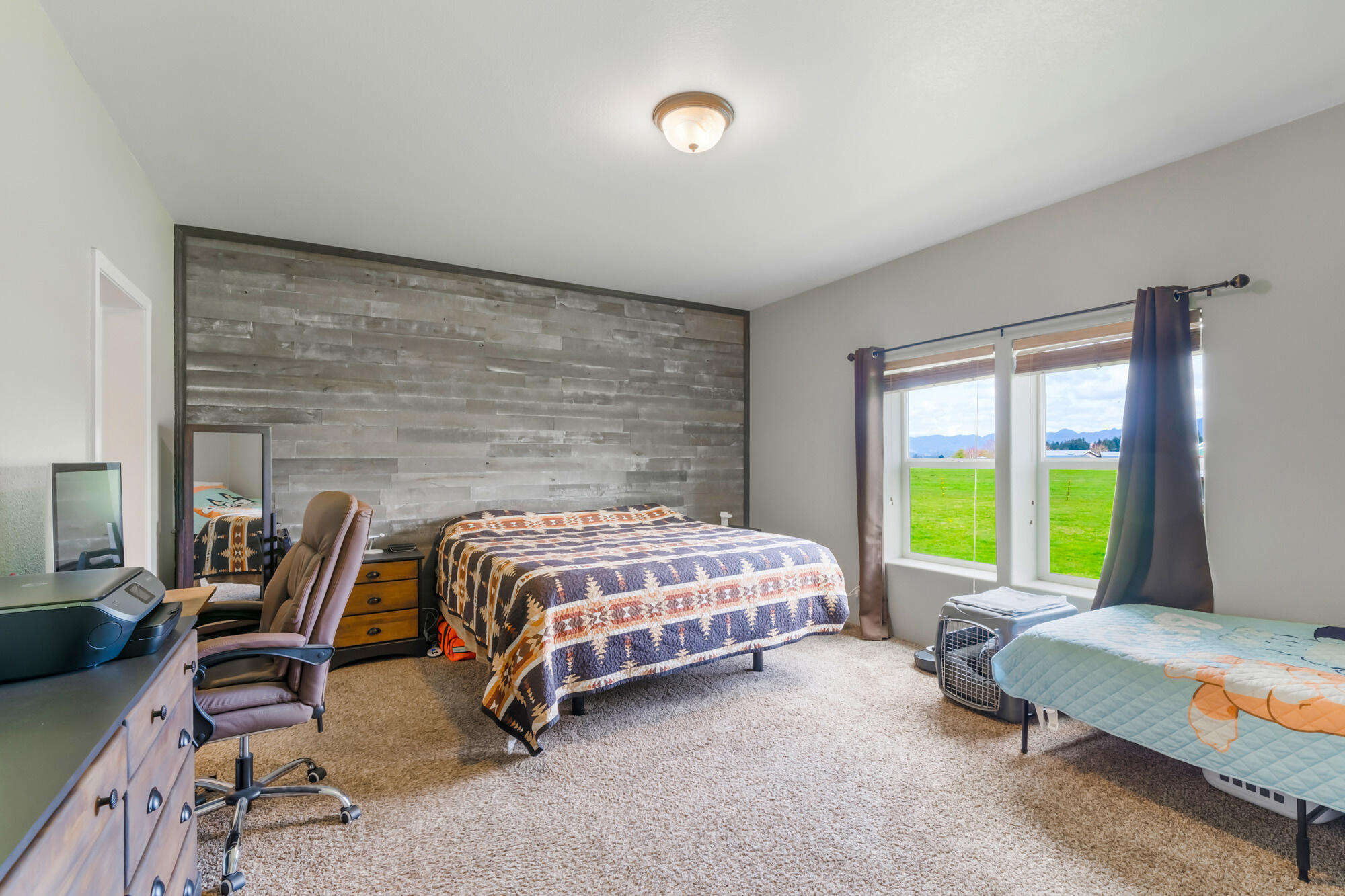 7400 South Prairie Road Tillamook, OR 97141 - Photo 46 of 62 a bedroom with a bed chair and a large window