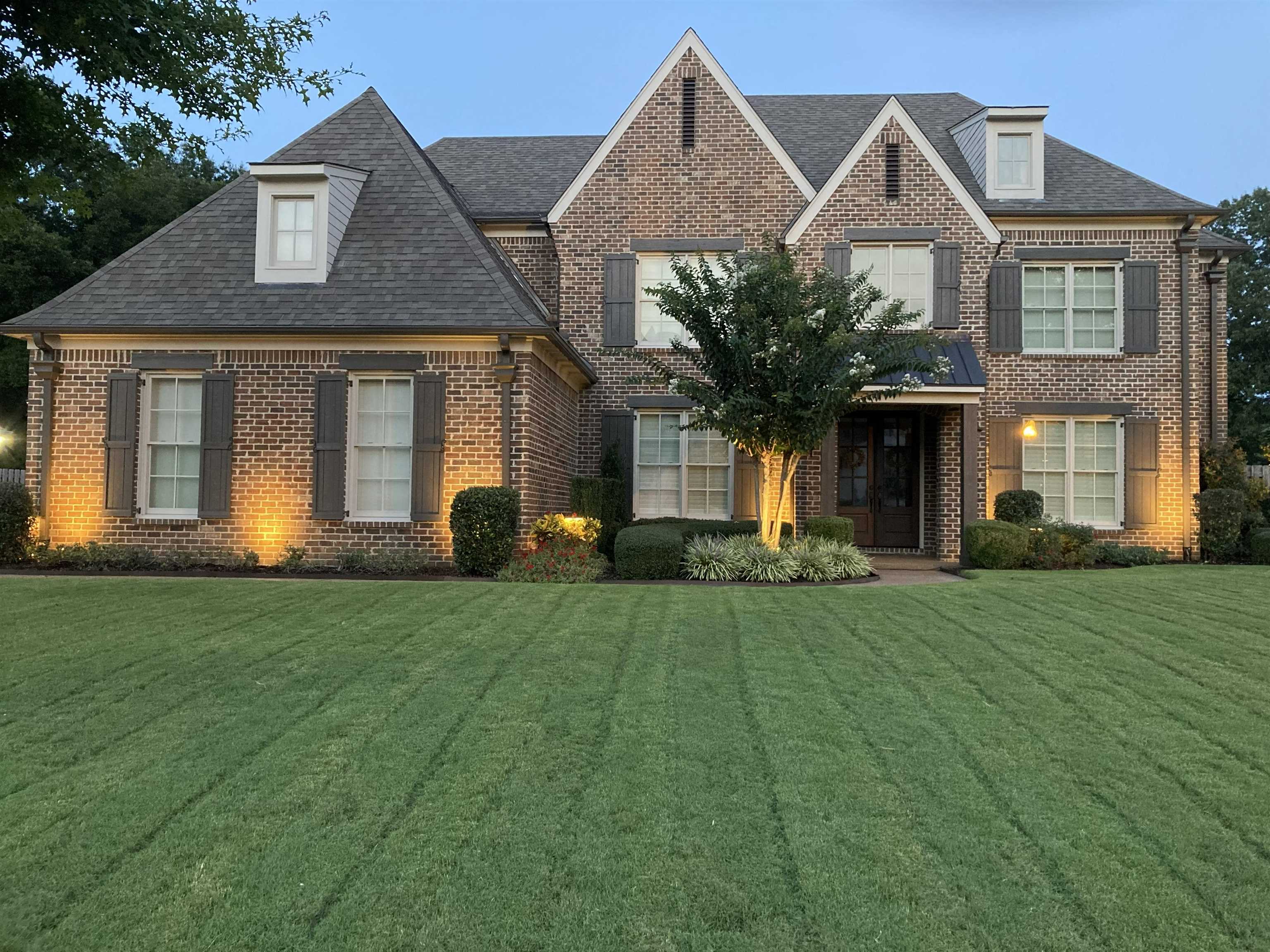 3246 North Hartwell Ridge Drive Collierville, TN 38017 - Photo 4 of 40 Traditional brick facade featuring a gabled roofline and multiple dormer windows