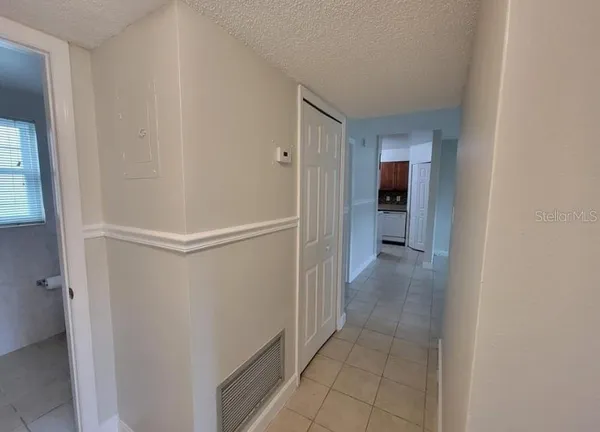 a view of a hallway with a closet