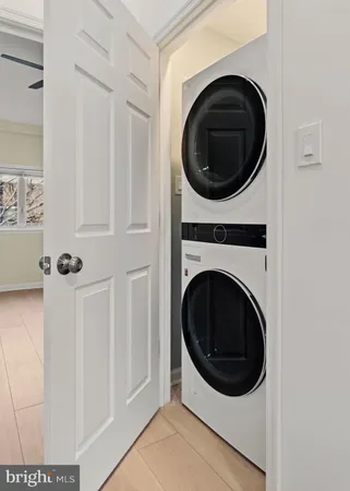 a view of a hallway with washer and dryer