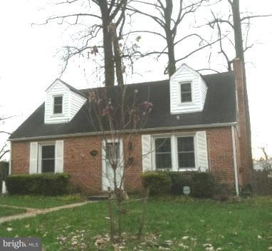 703 Sudbrook Road Pikesville, MD 21208 - Photo 15 of 15 front view of a house with a yard