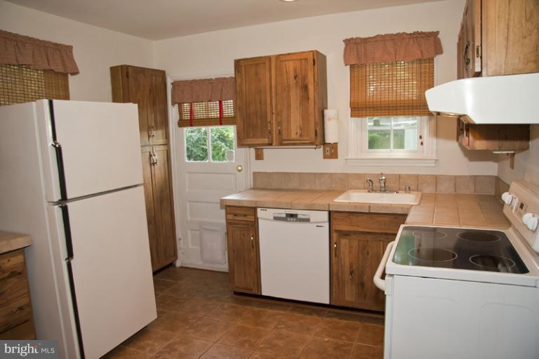 703 Sudbrook Road Pikesville, MD 21208 - Photo 10 of 15 a utility room with dryer and washer