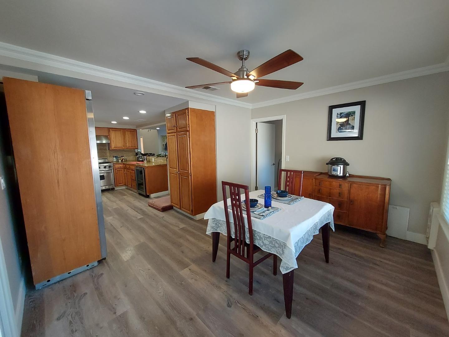 21390 Aldercroft Heights Road Los Gatos, CA 95033 - Photo 11 of 23 a view of a dining room with furniture window and wooden floor