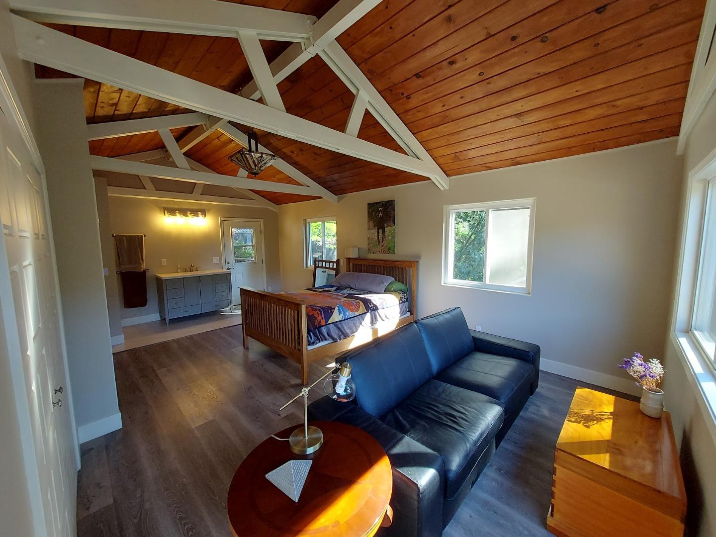 21390 Aldercroft Heights Road Los Gatos, CA 95033 - Photo 14 of 23 a living room with furniture and a wooden floor