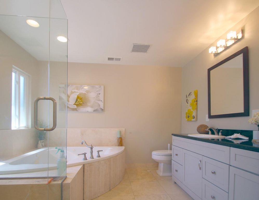 21390 Aldercroft Heights Road Los Gatos, CA 95033 - Photo 17 of 23 a bathroom with a sink a toilet and a mirror