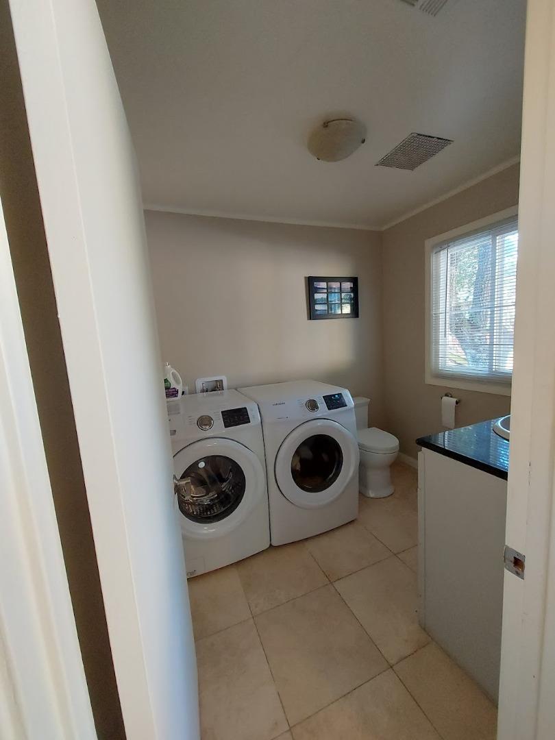 21390 Aldercroft Heights Road Los Gatos, CA 95033 - Photo 18 of 23 a utility room with dryer and washer
