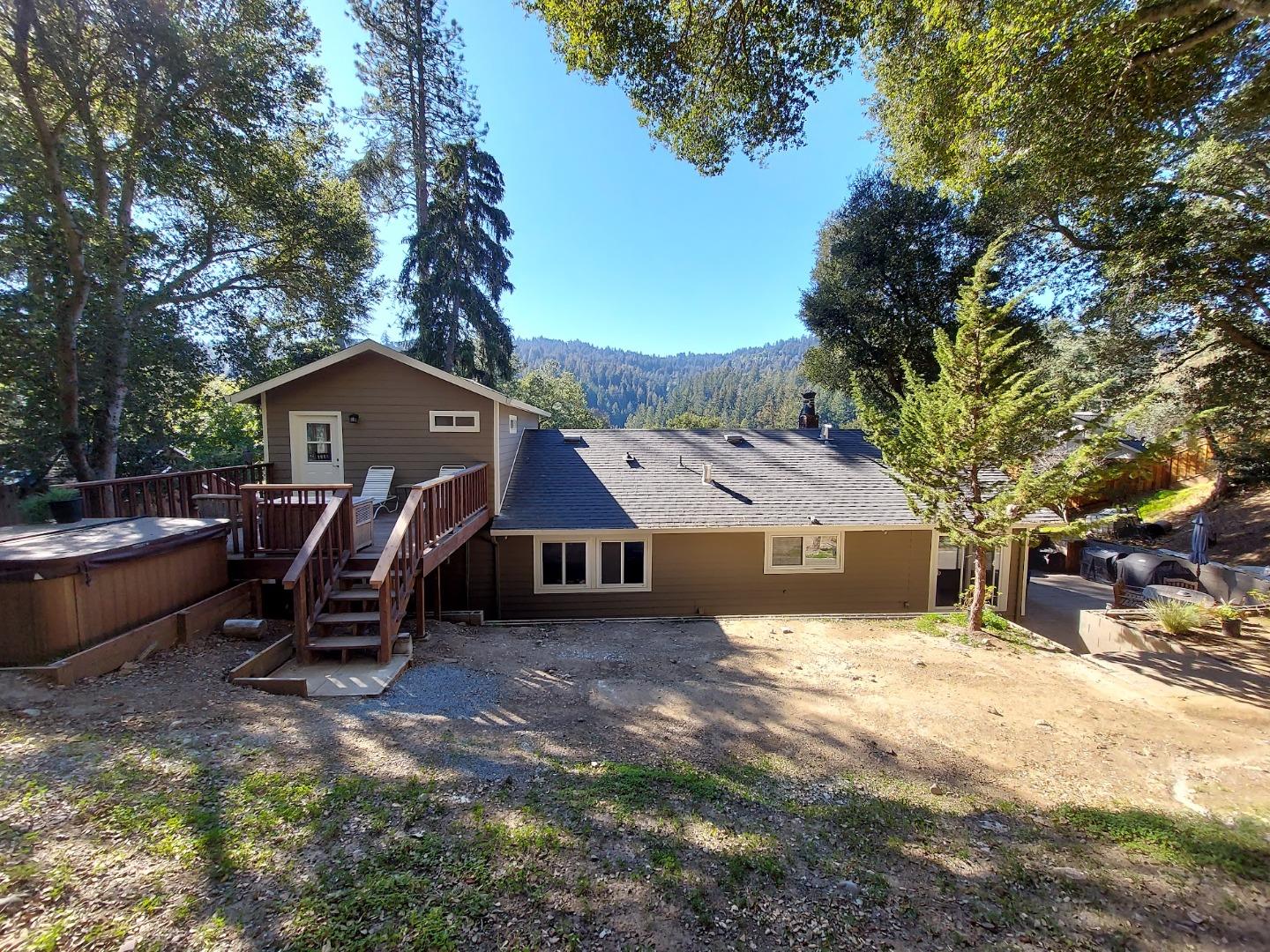 21390 Aldercroft Heights Road Los Gatos, CA 95033 - Photo 19 of 23 a front view of a house with a yard and large trees