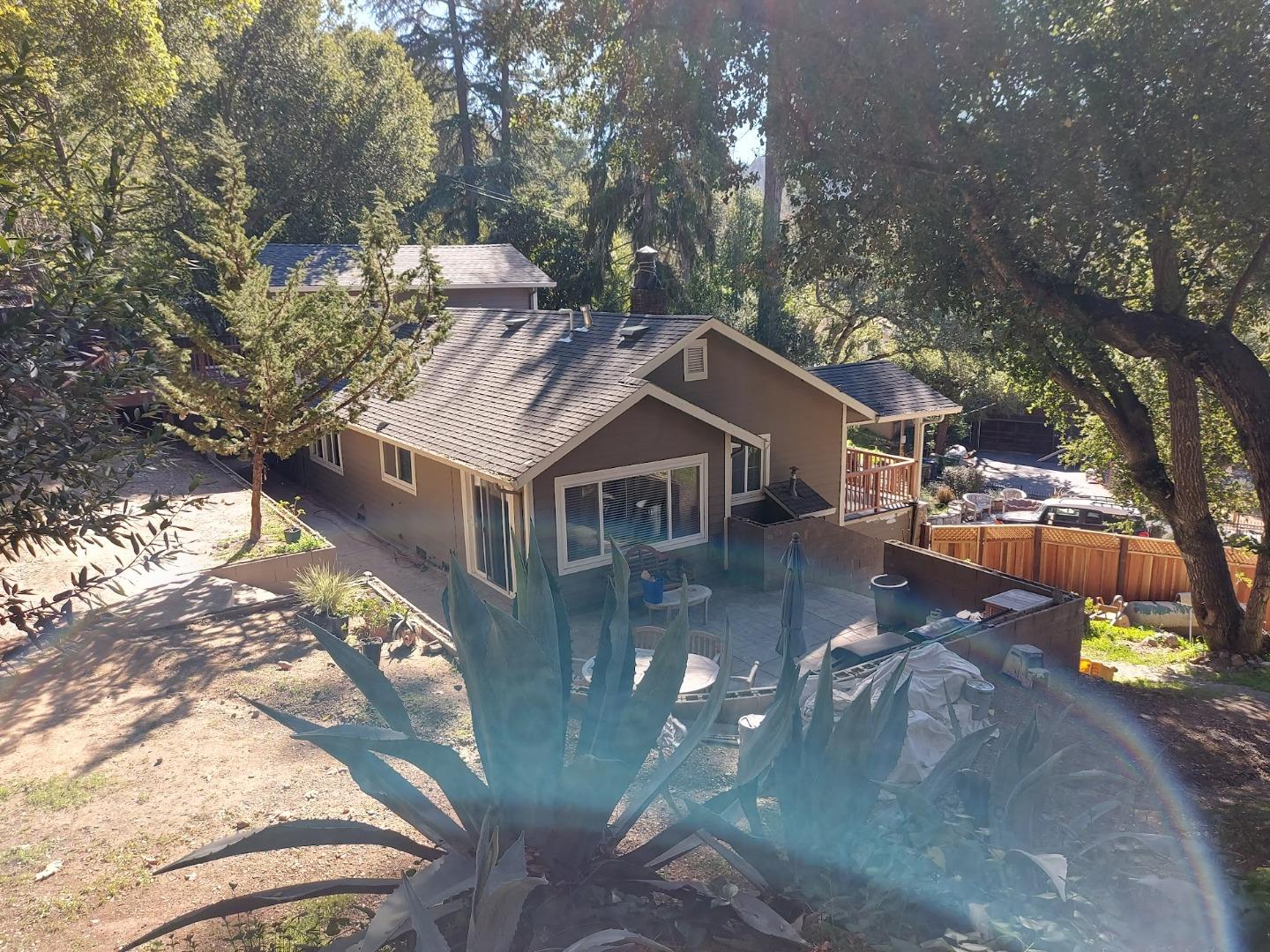 21390 Aldercroft Heights Road Los Gatos, CA 95033 - Photo 23 of 23 a view of a house with large trees in the background