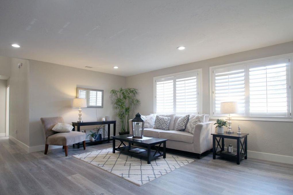 21390 Aldercroft Heights Road Los Gatos, CA 95033 - Photo 5 of 23 a living room with furniture and a window