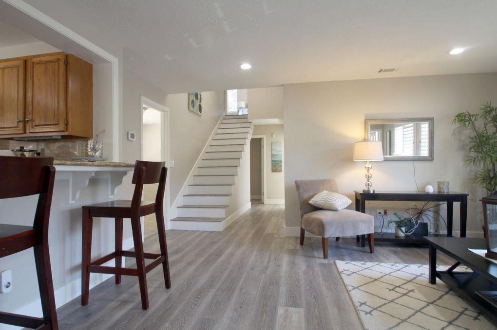 21390 Aldercroft Heights Road Los Gatos, CA 95033 - Photo 7 of 23 a living room with furniture and a wooden floor