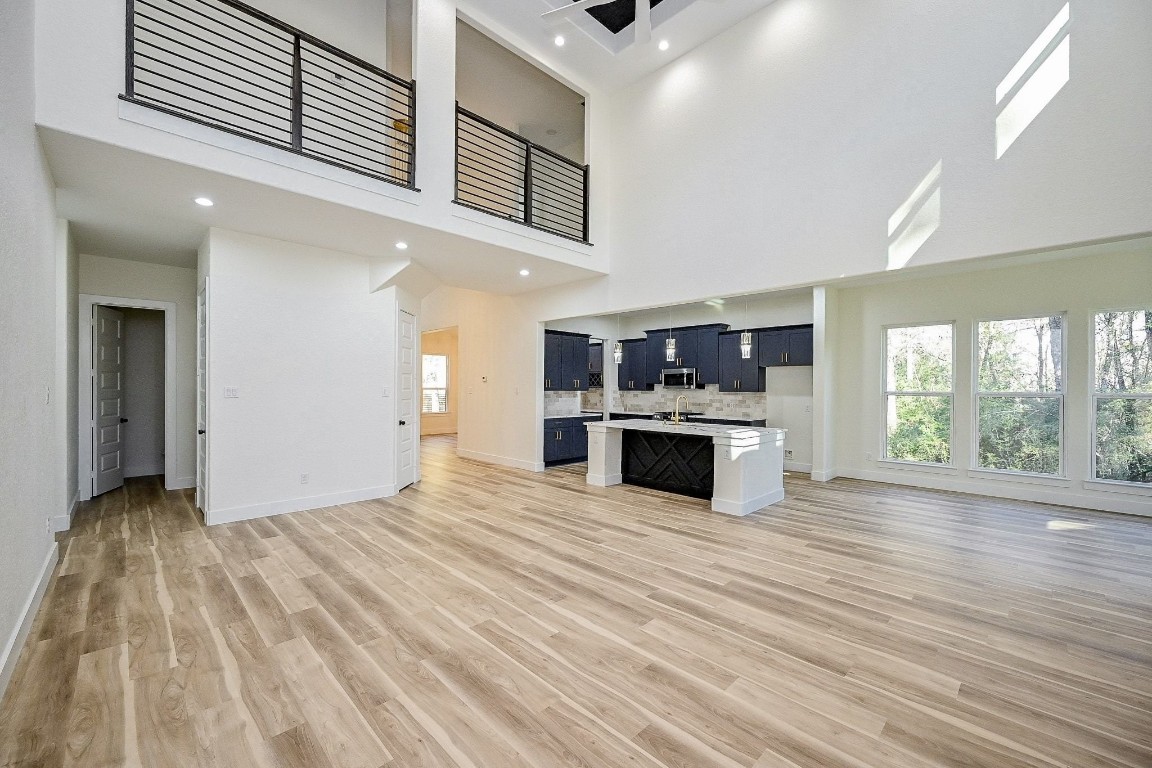 21614 Lee Road Humble, TX 77338 - Photo 12 of 36 a kitchen with stainless steel appliances granite countertop a stove and a sink