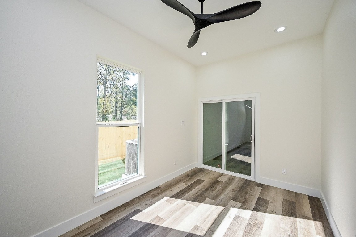 21614 Lee Road Humble, TX 77338 - Photo 13 of 36 an empty room with windows and closet