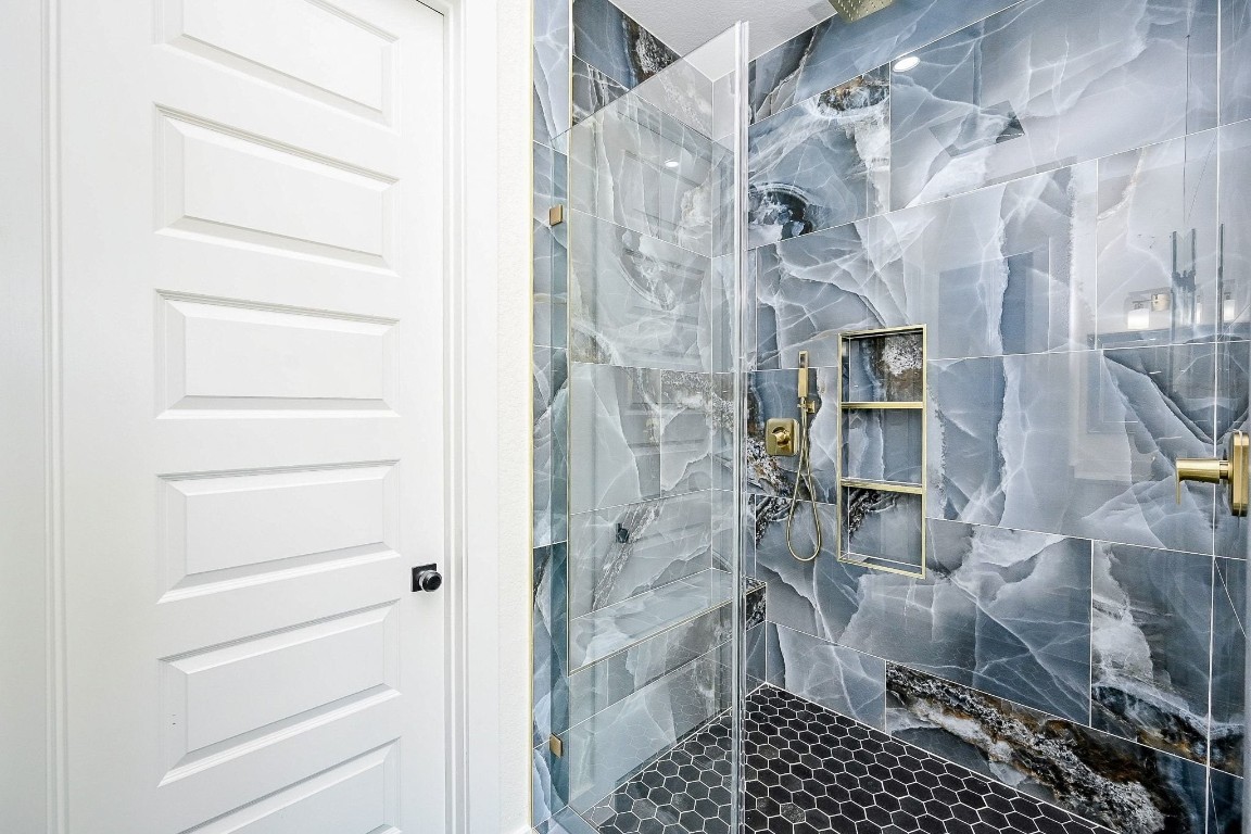 21614 Lee Road Humble, TX 77338 - Photo 21 of 36 a bathroom with a shower