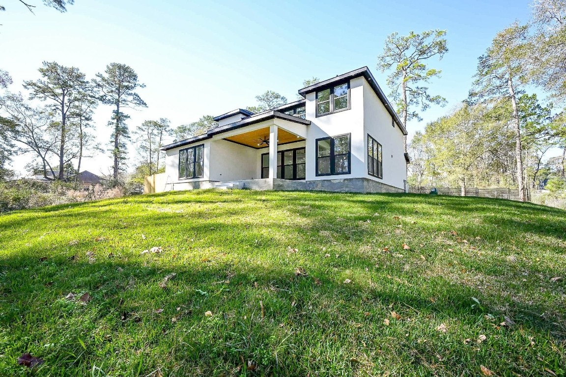 21614 Lee Road Humble, TX 77338 - Photo 30 of 36 a front view of a house with a yard and trees