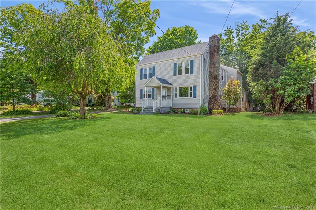 159 Ridgewood Road West Hartford, CT 06107 - Photo 1 of 1 a front view of a house with a garden