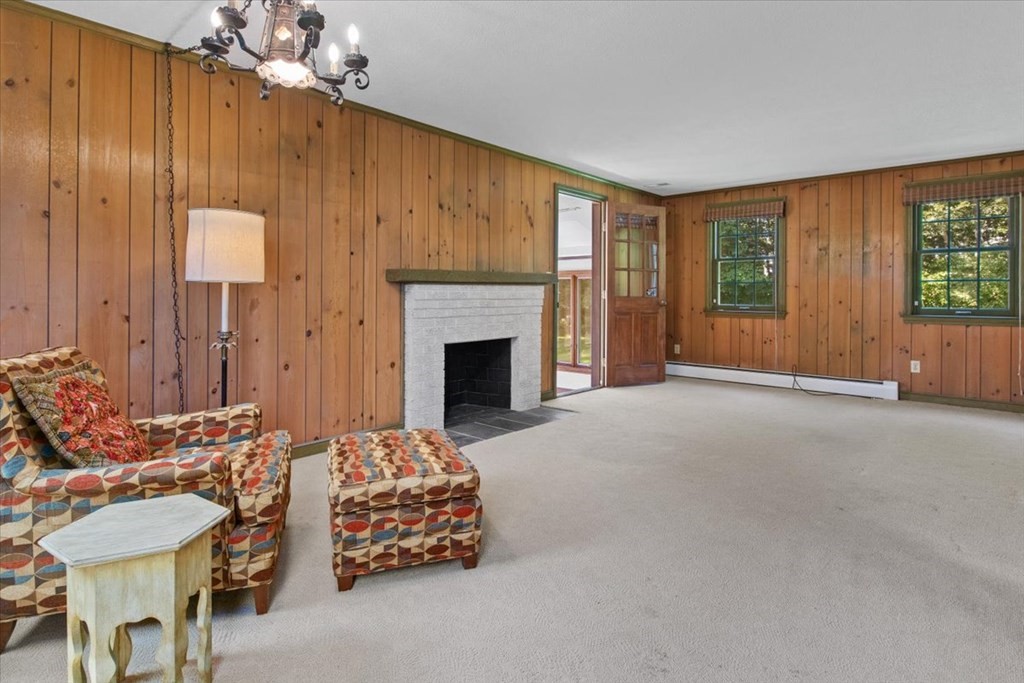 44 Ellis Street Medway, MA 02053 - Photo 11 of 42 a living room with furniture and a fireplace