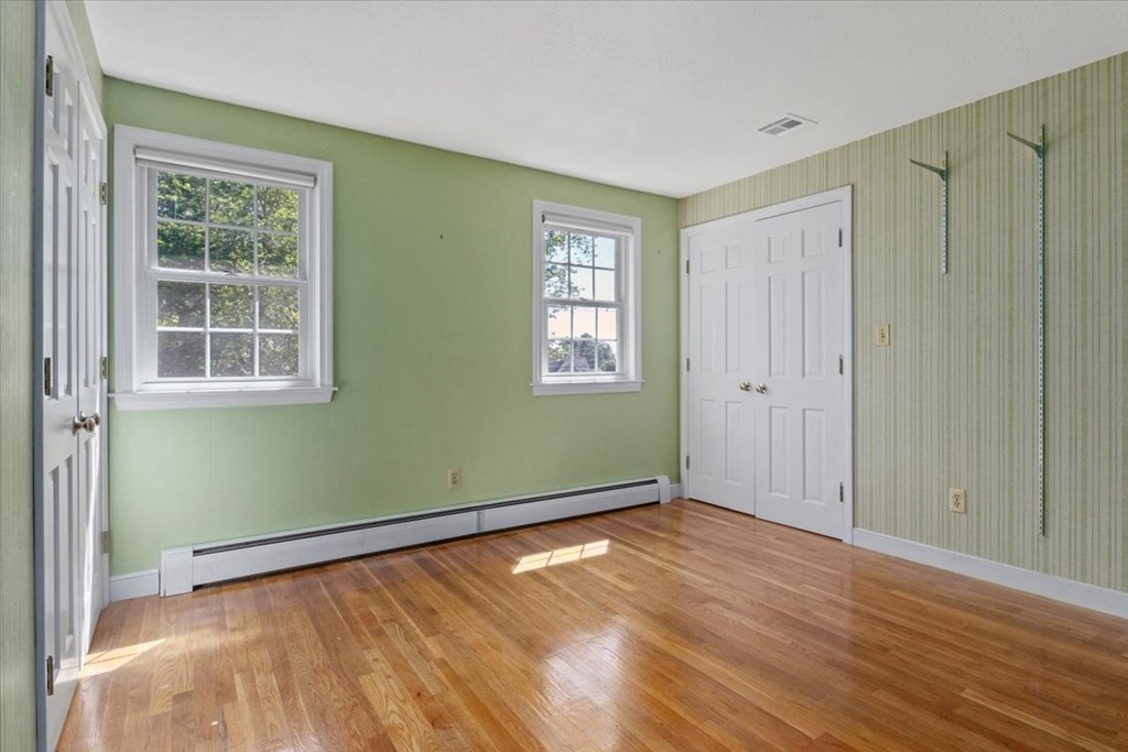 44 Ellis Street Medway, MA 02053 - Photo 22 of 42 an empty room with wooden floor and windows