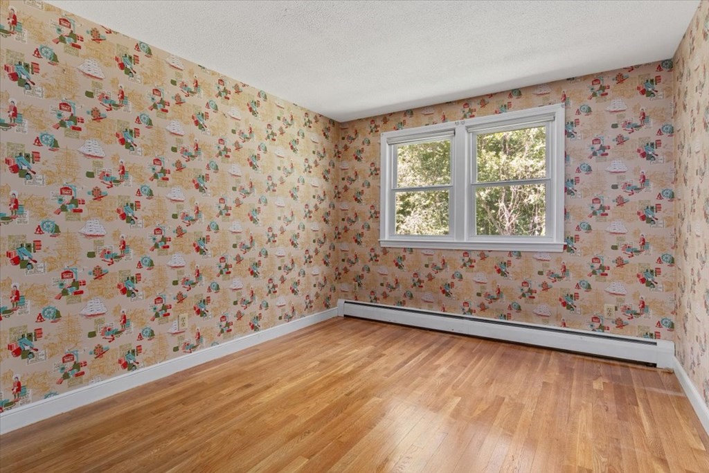 44 Ellis Street Medway, MA 02053 - Photo 24 of 42 a view of an empty room and wooden floor