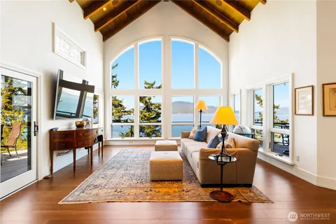 a living room with furniture fireplace and a flat screen tv