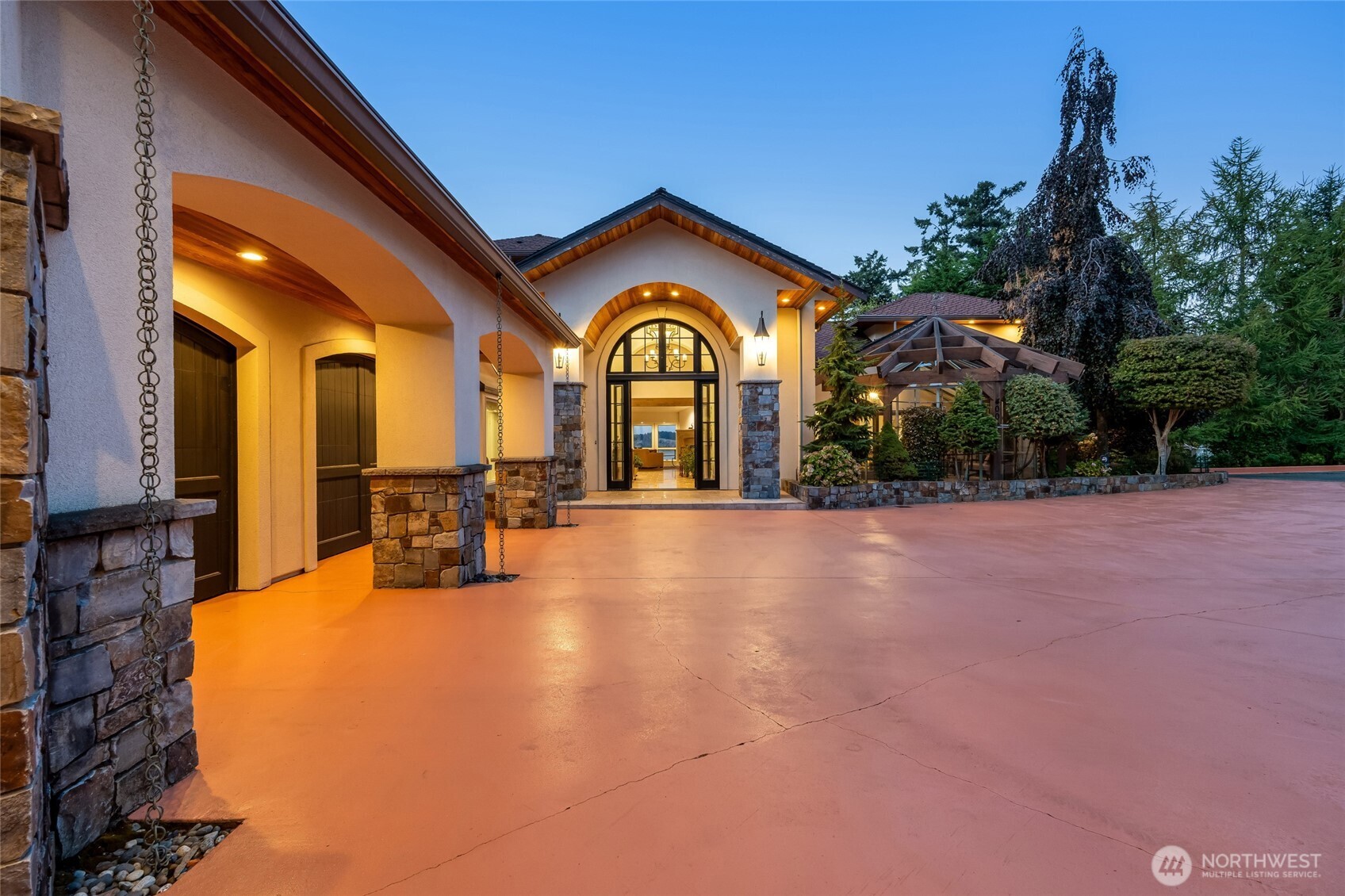 4002 Oakes Avenue Anacortes, WA 98221 - Photo 36 of 38 a view of a house with a large tree and a yard