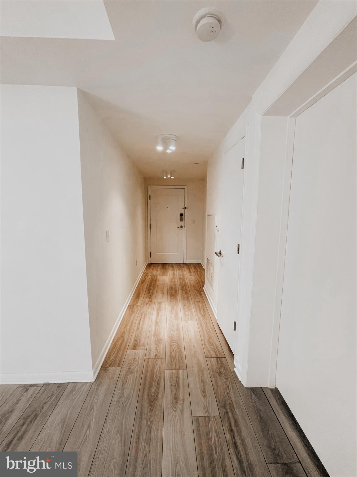 350 G Street Southwest, Unit N501 Washington, DC 20024 - Photo 17 of 49 a view of a hallway with wooden floor
