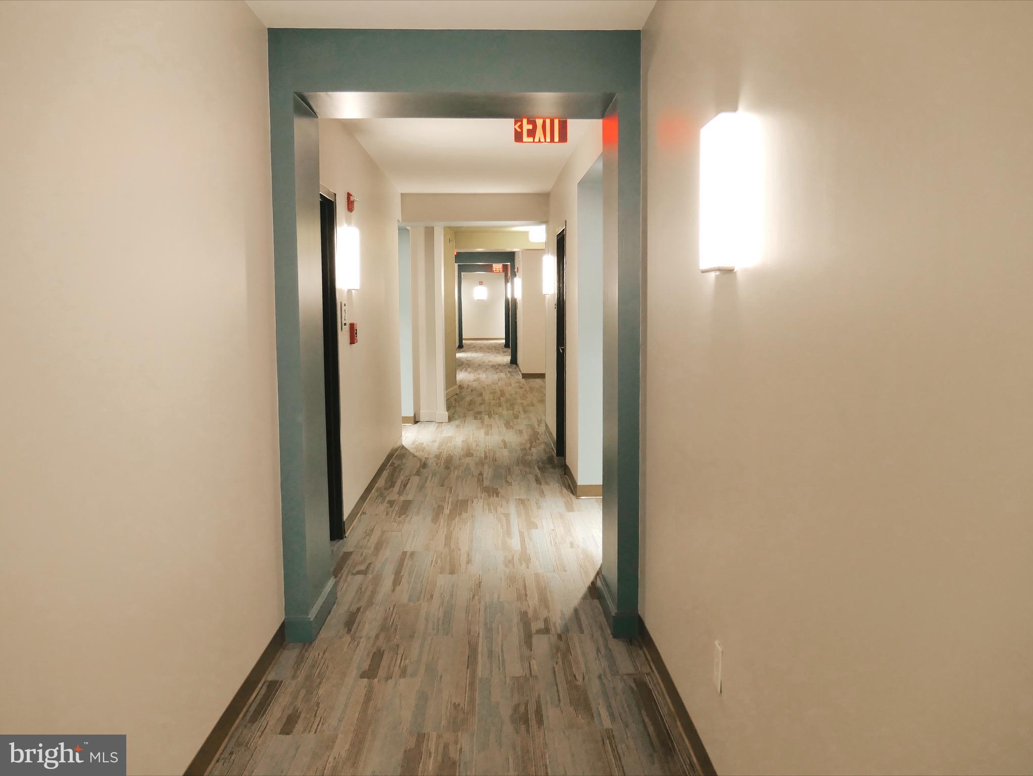 350 G Street Southwest, Unit N501 Washington, DC 20024 - Photo 6 of 49 a view of a hallway with wooden floor